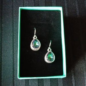 Silvery earrings with stones in the colors of a mystic topaz.